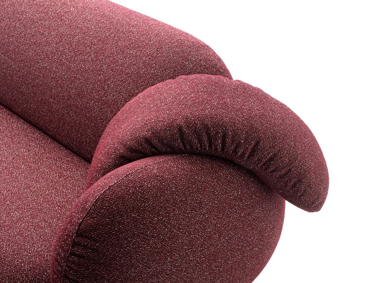 Close-up of a textured maroon cushion of Leolux Pulla Sofa