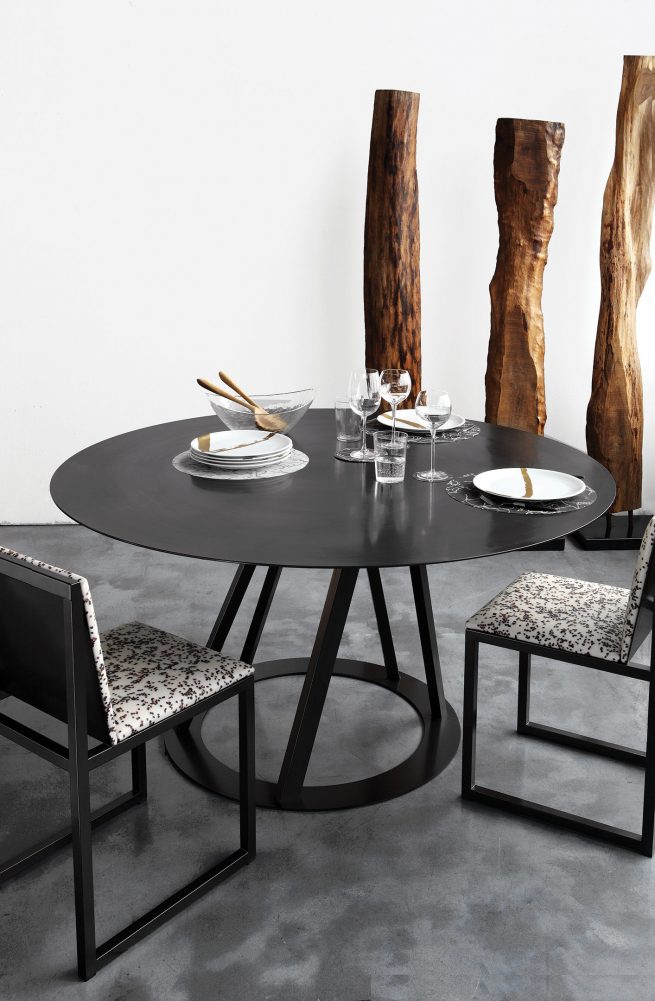 Italian Dining Table and dining chairs from Zeus Big Irony Metal Round Dining Table contemporary steel  black epoxy finish