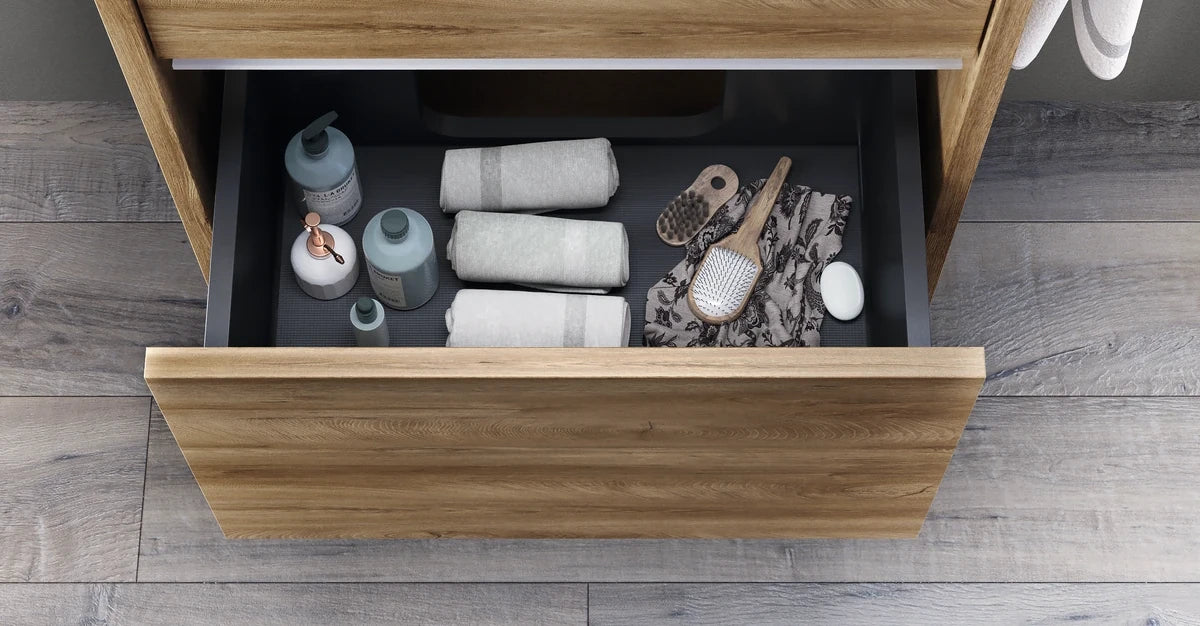 Bathroom Vanity with sink top n wood finish, wall hung vanity by Mastella Italy, showing drawer detail in bathroom setting